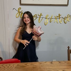 Dark blue dress more formal and layered bottom.